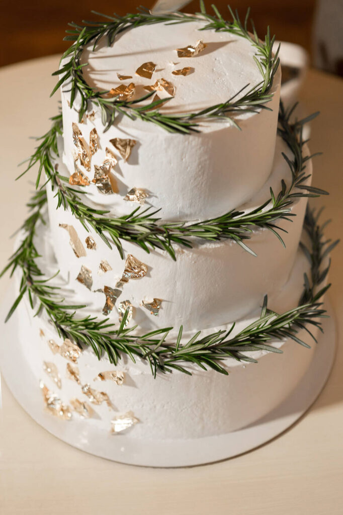 cake decorated with fresh green leaves